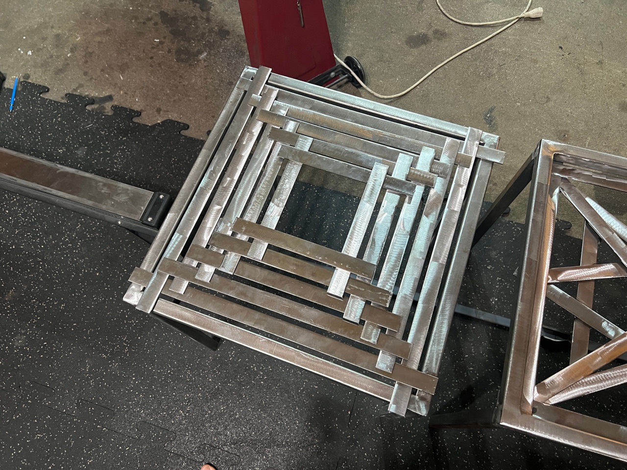 Geometric steel table — top